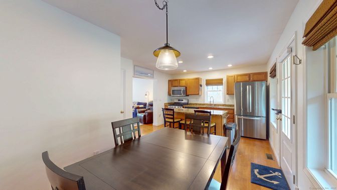 Dining room, Interior, Kitchen, Pendant Lights, Recessed Lighting, Stainless Steel Appliances, Wood Texture Flooring