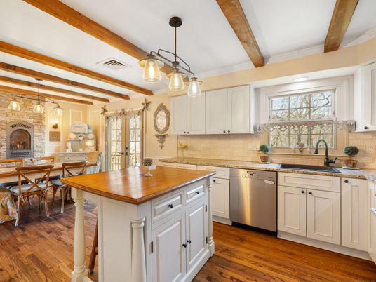 Dining room, Fireplace, Interior, Kitchen, Pendant Lights, Stainless Steel Appliances, Stone Walls, Wooden Beams, Wood Texture Flooring