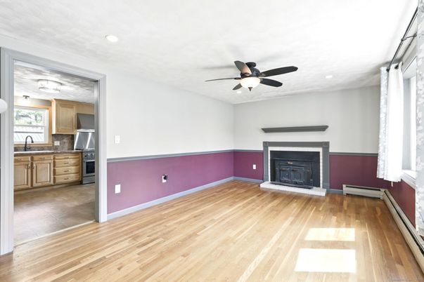 Empty room, Fireplace, Interior, Kitchen, Recessed Lighting, Wood Texture Flooring
