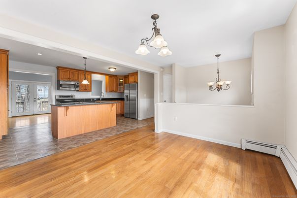 Chandelier, Interior, Kitchen, Pendant Lights, Recessed Lighting, Stainless Steel Appliances, Wood Texture Flooring