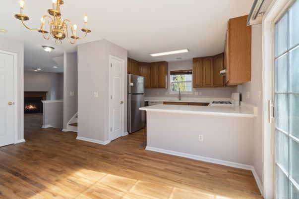 Chandelier, Fireplace, Interior, Kitchen, Recessed Lighting, Wood Texture Flooring