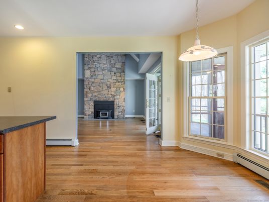 Empty room, Fireplace, Interior, Pendant Lights, Recessed Lighting, Stone Walls, Wood Texture Flooring