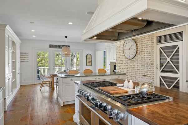 Dining room, Interior, Kitchen, Pendant Lights, Recessed Lighting, Stainless Steel Appliances, Stone Walls, Wood Texture Flooring