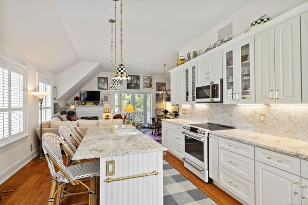 Dining room, Fireplace, Interior, Kitchen, Living room, Pendant Lights, Stainless Steel Appliances, Wood Texture Flooring
