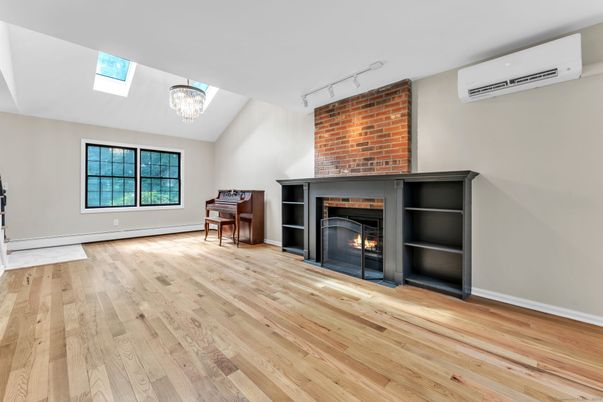 Chandelier, Fireplace, Interior, Piano, Stone Walls, Wood Texture Flooring