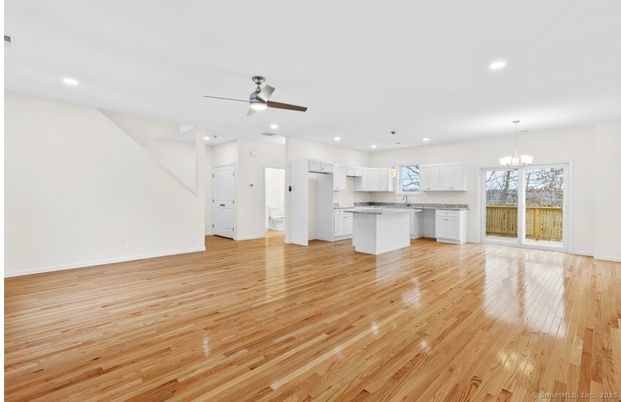 Chandelier, Empty room, Interior, Kitchen, Pendant Lights, Recessed Lighting, Stainless Steel Appliances, Wood Texture Flooring