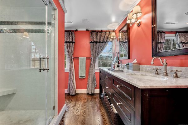 Bathroom, Dual Sink Vanities, Glass Shower, Interior, Recessed Lighting, Wood Texture Flooring