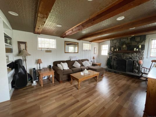 Fireplace, Interior, Living room, Recessed Lighting, Stone Walls, Wooden Beams, Wood Texture Flooring