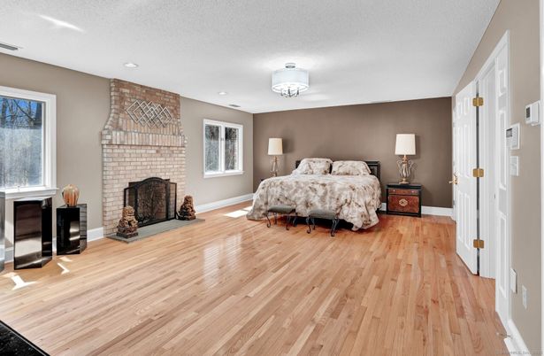 Bedroom, Fireplace, Interior, Recessed Lighting, Stone Walls, Wood Texture Flooring