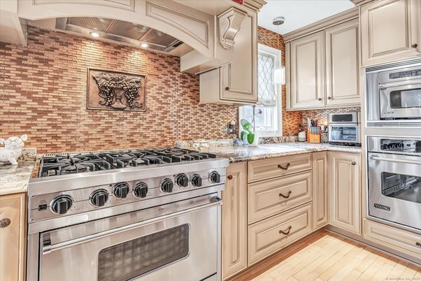 Interior, Kitchen, Pendant Lights, Stainless Steel Appliances, Stone Walls, Wood Texture Flooring
