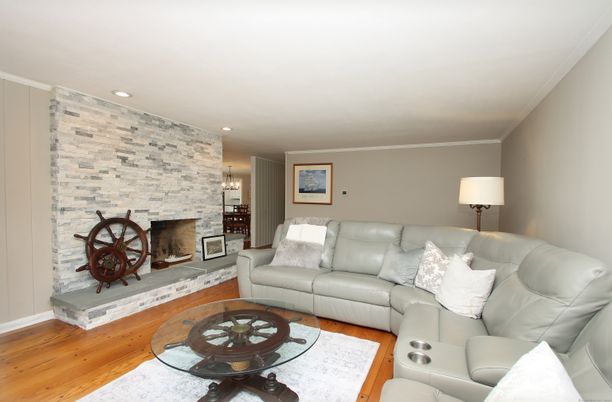 Fireplace, Interior, Living room, Recessed Lighting, Stone Walls, Wood Texture Flooring