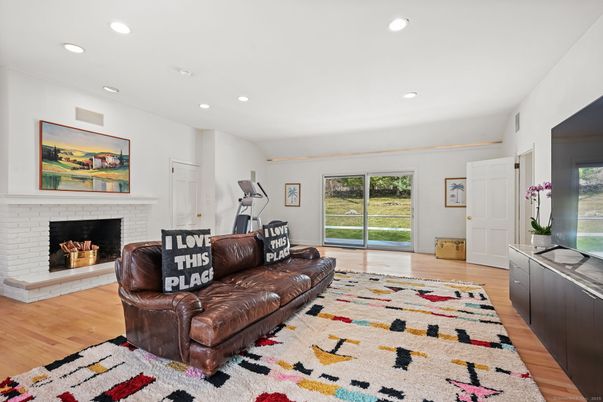 Fireplace, Fitness Equipment, Interior, Living room, Recessed Lighting, Wood Texture Flooring