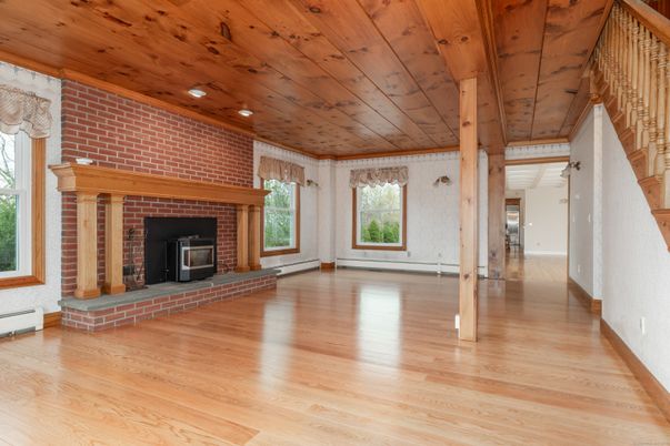 Empty room, Fireplace, Interior, Recessed Lighting, Stone Walls, Wooden Ceilings, Wood Texture Flooring