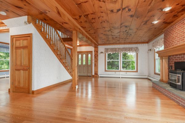 Empty room, Fireplace, Interior, Recessed Lighting, Stone Walls, Wooden Beams, Wooden Ceilings, Wood Texture Flooring