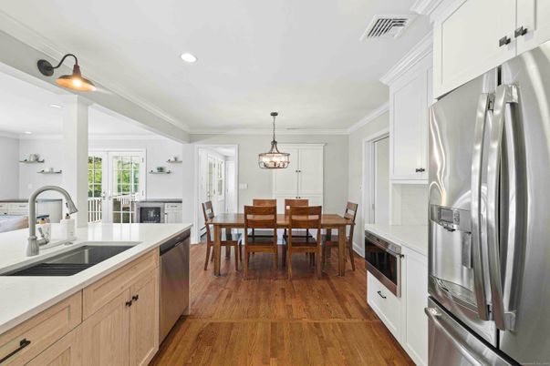 Dining room, Interior, Kitchen, Pendant Lights, Recessed Lighting, Stainless Steel Appliances, Wood Texture Flooring