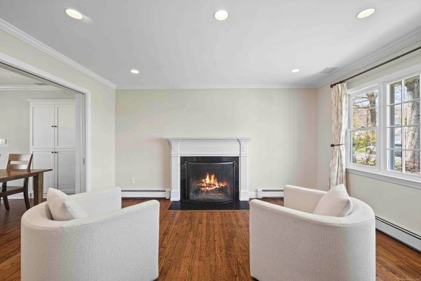 Dining room, Fireplace, Interior, Living room, Recessed Lighting, Wood Texture Flooring