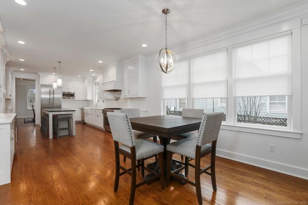 Dining room, Interior, Kitchen, Pendant Lights, Recessed Lighting, Stainless Steel Appliances, Wood Texture Flooring