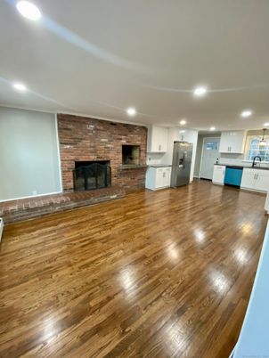Empty room, Fireplace, Interior, Kitchen, Recessed Lighting, Stone Walls, Wood Texture Flooring