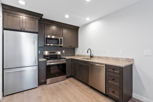 Interior, Kitchen, Recessed Lighting, Stainless Steel Appliances, Wood Texture Flooring