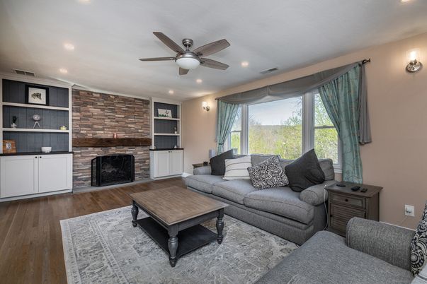 Fireplace, Interior, Living room, Recessed Lighting, Stone Walls, Wood Texture Flooring