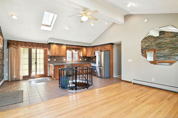 Interior, Kitchen, Recessed Lighting, Stainless Steel Appliances, Stone Walls, Wood Texture Flooring