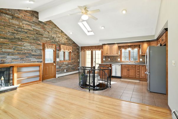 Fireplace, Interior, Kitchen, Recessed Lighting, Stone Walls, Wood Texture Flooring