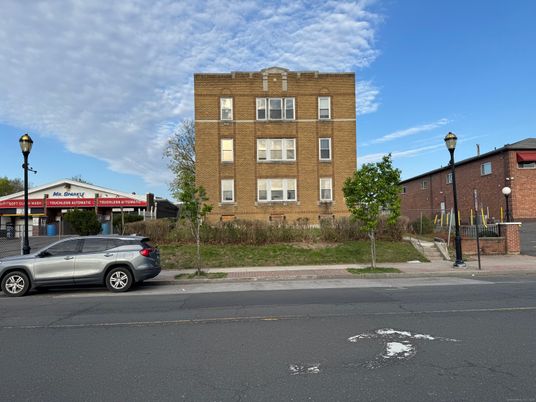 Exterior, Facade, Brick Facade, Condo Building