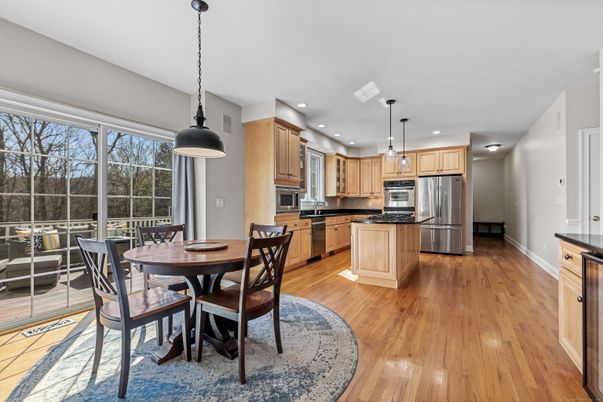 Dining room, Interior, Kitchen, Pendant Lights, Recessed Lighting, Stainless Steel Appliances, Wood Texture Flooring