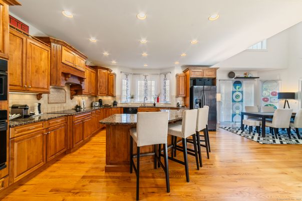 Dining room, Interior, Kitchen, Recessed Lighting, Stainless Steel Appliances, Wood Texture Flooring