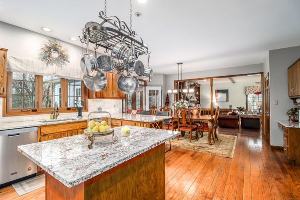Chandelier, Dining room, Interior, Kitchen, Pendant Lights, Recessed Lighting, Stainless Steel Appliances, Wood Texture Flooring