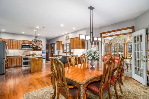 Chandelier, Dining room, Interior, Kitchen, Pendant Lights, Recessed Lighting, Stainless Steel Appliances, Wood Texture Flooring