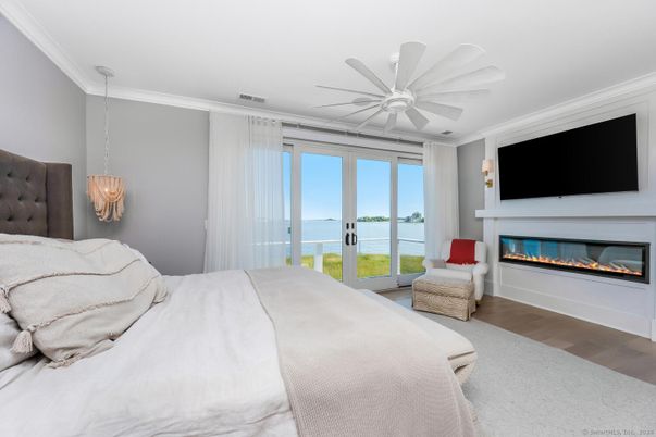 Bedroom, Fireplace, Interior, Pendant Lights, Water, Wood Texture Flooring