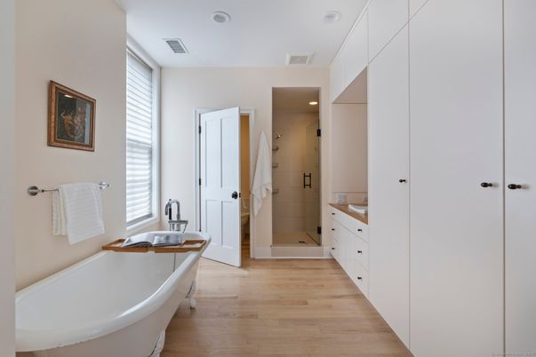 Bathroom, Dual Sink Vanities, Free Standing Baths, Interior, Recessed Lighting, Wood Texture Flooring