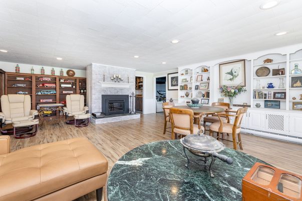 Dining room, Fireplace, Interior, Living room, Recessed Lighting, Wood Texture Flooring