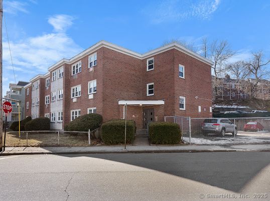 Exterior, Facade, Brick Facade, Condo Building