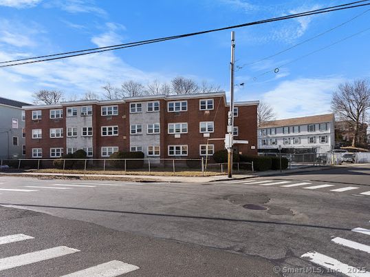 Exterior, Facade, Brick Facade, Condo Building