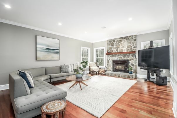 Fireplace, Interior, Living room, Recessed Lighting, Stone Walls, Wood Texture Flooring