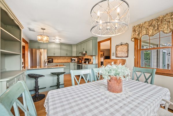 Chandelier, Dining room, Interior, Kitchen, Stainless Steel Appliances, Wood Texture Flooring