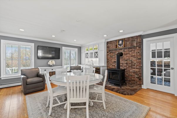 Dining room, Fireplace, Interior, Recessed Lighting, Stone Walls, Wood Texture Flooring