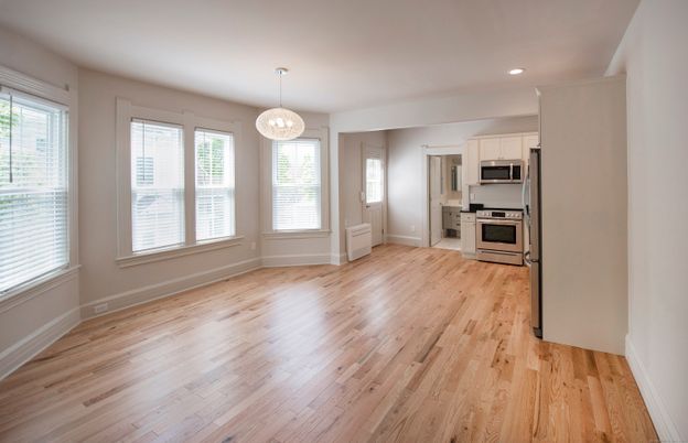 Empty room, Interior, Kitchen, Recessed Lighting, Stainless Steel Appliances, Wood Texture Flooring