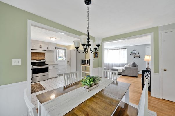 Chandelier, Dining room, Interior, Kitchen, Living room, Pendant Lights, Stainless Steel Appliances, Wood Texture Flooring