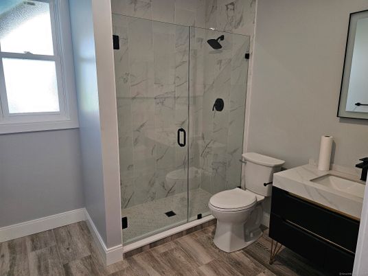 Bathroom, Glass Shower, Interior, Marble Walls, Wood Texture Flooring