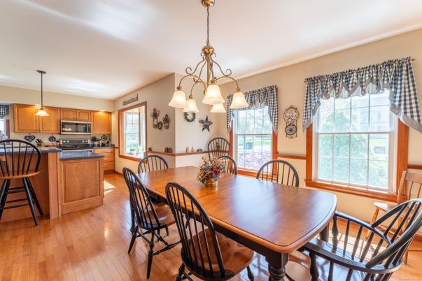 Chandelier, Dining room, Interior, Kitchen, Pendant Lights, Stainless Steel Appliances, Wood Texture Flooring