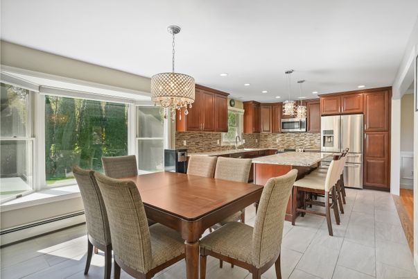 Chandelier, Dining room, Interior, Kitchen, Pendant Lights, Recessed Lighting, Stainless Steel Appliances, Wood Texture Flooring