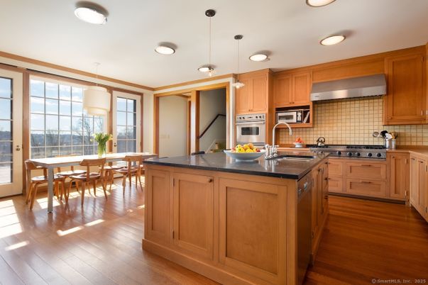 Dining room, Interior, Kitchen, Pendant Lights, Recessed Lighting, Stainless Steel Appliances, Wood Texture Flooring