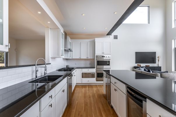 Interior, Kitchen, Recessed Lighting, Stainless Steel Appliances, Wood Texture Flooring