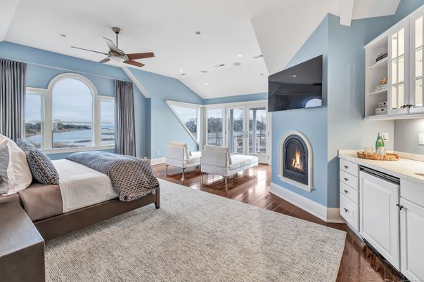 Bedroom, Fireplace, Interior, Recessed Lighting, Water, Wood Texture Flooring