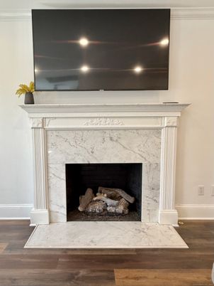 Fireplace, Interior, Marble Walls, Recessed Lighting, Wood Texture Flooring