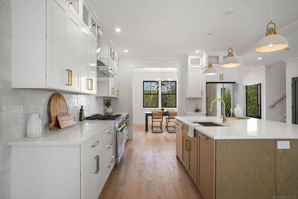 Dining room, Interior, Kitchen, Pendant Lights, Recessed Lighting, Stainless Steel Appliances, Wood Texture Flooring