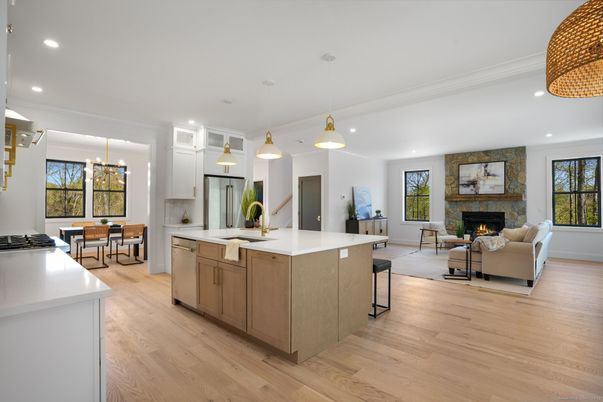 Dining room, Fireplace, Interior, Kitchen, Living room, Pendant Lights, Recessed Lighting, Stainless Steel Appliances, Stone Walls, Wood Texture Flooring